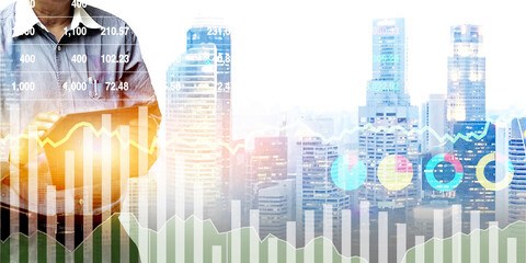 Stock financial index symbol of graph and chart with man operating tablet on urban background. Image use for banking and economics presentation background.
