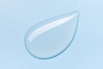 transparent gel serum on blue background