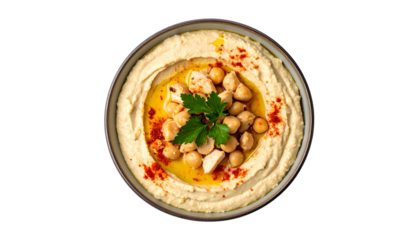 Creamy, beige hummus bowl, topped with chickpeas, paprika, parsley, and olive oil