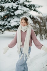 Young woman enjoying cold winter day smiling outside