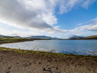 Scottish loch landscape view with mountains and clouds