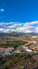 Panorama of the town of Los Cristianos with a volcano in the background. Tenerife, Canary Islands