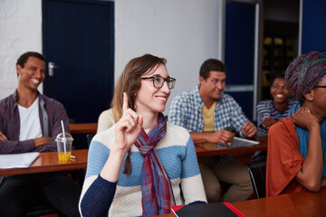Woman, raised hand and question in university class for feedback, knowledge or opinion. Student, communication and gesture for answer with college, learning and pupil in lecture or scholarship