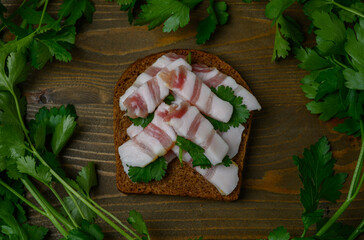 Sandwich with Lard "Christmas Tree" on Wooden Table with Parsley Wreath