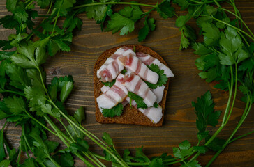 Lard "Christmas Tree" Sandwich on Wooden Table Decorated with Parsley