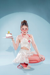 Elegant Asian beauty celebrates 30th birthday in white lace halter crop top and ruffled mini skirt with red ribbons, holding red velvet cake, wearing red heart glasses and cherry earrings, glamorous 