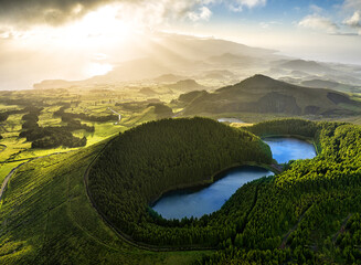 Azores - Aerial view of the volcanic mountains and lakes, with green farmland of Sete Cidades on...