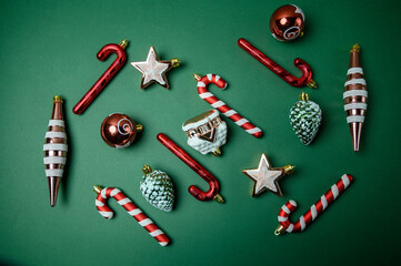 New Year Composition with Christmas Ornaments on Green Background