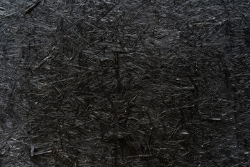 Black Painted OSB Wood Texture Background with Visible Strands