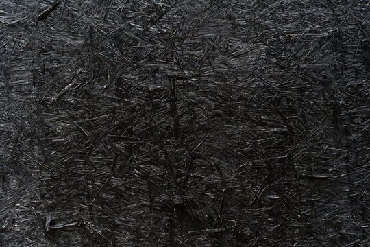 Black Painted OSB Wood Texture Background with Visible Strands