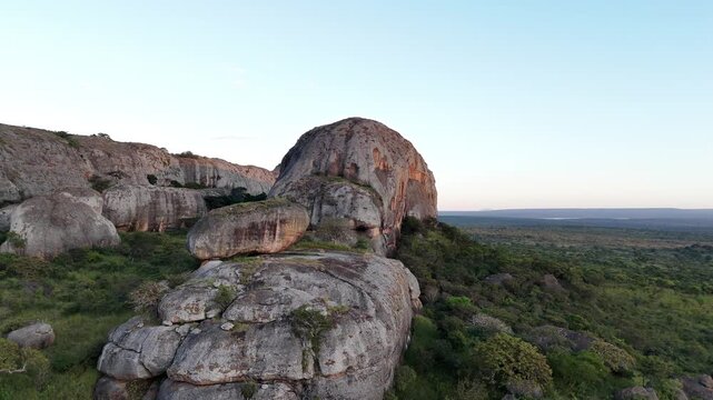 drone close up sunset view of ancient stone towers at Pedras Negras de Pungo Andongo, Malanje, Angola, Southern Africa, showcasing a unique geological heritage