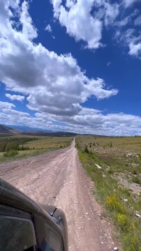 View from the car window of the nature of the Buguzun Pass. Off-road route from Tyva to Altai through the Buguzun Pass along the Mongolian border. Chikhachev Range of the Altai Mountains. 4К