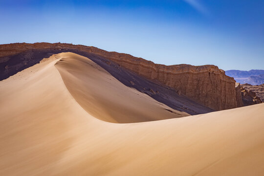 Sand dune and rock formations in Moon Valley near San Pedro de Atacama