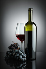 Red wine and juicy blue grapes.