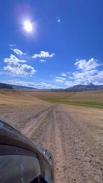 View from the car window of the nature of the Buguzun Pass. Off-road route from Tyva to Altai through the Buguzun Pass along the Mongolian border. Chikhachev Range of the Altai Mountains. 4К