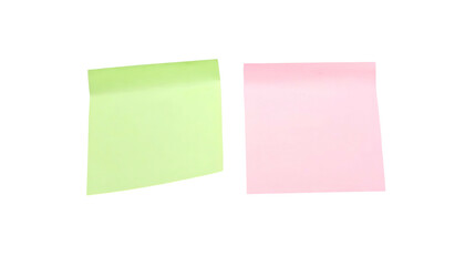 Fototapeta premium Two colorful sticky notes, green and pink, against a black background