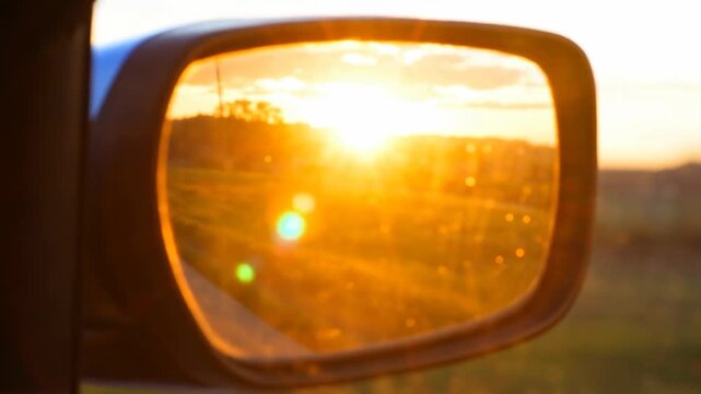 Calm sunrise reflection golden light morning drive ritual window view aesthetic mood car mirror glow landscape horizon sky beam journey sunrise reflection car mirror road rural calm morning ritual