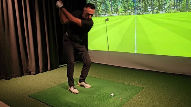 Golf practice session indoors with advanced technology for improving swing and accuracy at a training facility