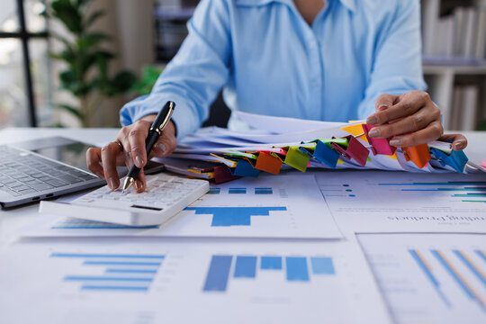 Business woman Auditor business woman working with financial documents in modern office
