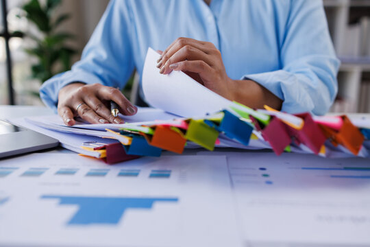 Business documents business woman check legal document review Prepare documents or analysis reports, tax items, accounting documents, data contracts, office partner agreements.
