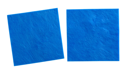 Two blue squares with textured surfaces, one tilted, against a stark black background