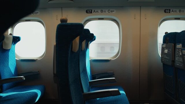 Empty blue seats inside a fast shinkansen bullet train in japan
