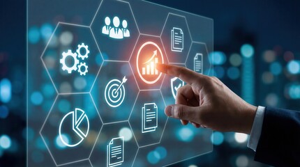 Professional hand interacts with a futuristic digital interface displaying glowing business data icons against a blurred blue city night background illustrating growth an