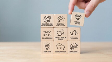 Hand places Decision Making wooden block on stack of business soft skill cubes with analytical thinking emotional intelligence and collaboration on light table against bl