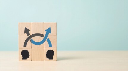 Wooden blocks with two human head silhouettes and intertwining arrows symbolizing communication brainstorming collaboration and shared growth on a light blue studio backg