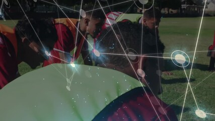 Animation of network of connections with gloving spots over diverse rugby players at stadium