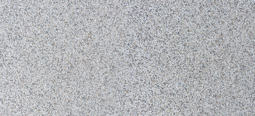 Gray speckled granite aggregate concrete texture background