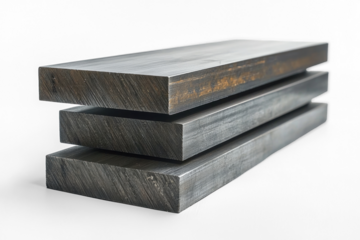 Three flat, rectangular bars are stacked on top of each other. The material appears to be metal, with visible surface texture and distinct, sharp edges