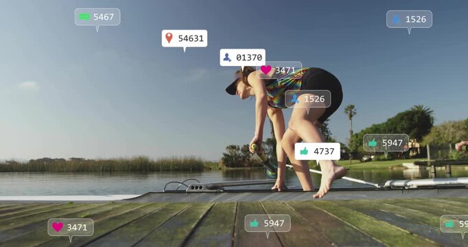 female athlete preparing oar on dock by lake, with floating heart icons boosting business analytics