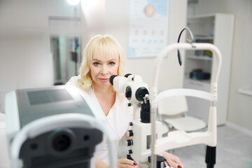 Ophthalmologist examines patient in eye clinic