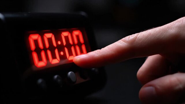 Countdown Explosion A hand trying to stop a Digital Countdown Timer at 0001, but it hits 0000 and flashes red intensely 4k video 