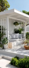 White Modern Outdoor Pergola Seating Area with Greenery