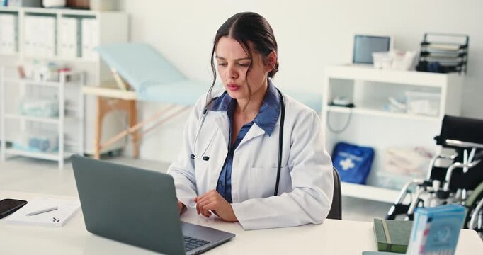 Shoulder pain, doctor and laptop with woman in hospital for fatigue, surgery stress or healthcare. Digital records, joint inflammation or medical strain with overworked person in clinic with workload