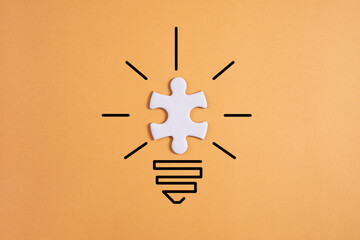 creative light bulb with puzzle pieces