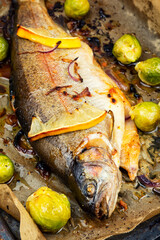 Rainbow trout baked on a baking sheet.