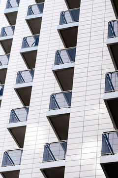 Abstract urban modern architecture facade building with diagonal windows and geometry showing repetition pattern background with dynamic perspective