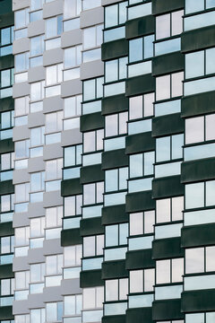 Abstract modern architecture facade with geometric grid mosaic panels showing repetition and texture pattern background for design wallpaper