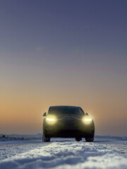 Car Driving on Snowy Road at Dusk © Bjorn B