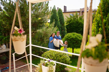 Family members pose together outside in the garden