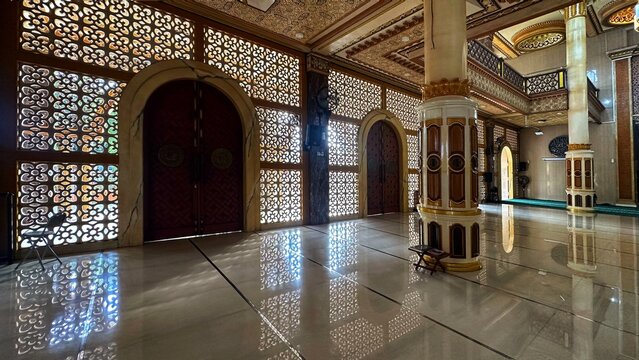 Luxurious Interior of a Modern Mosque with Ornamental Walls and Marble Floors