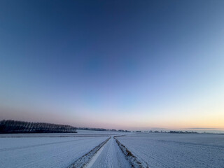 Snowy Road in Tranquil Winter Landscape