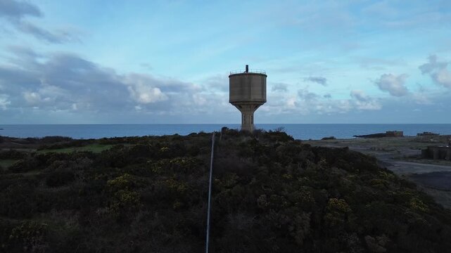Disused Octel chemical facility aerial view towards abandoned industrial water tower ruin