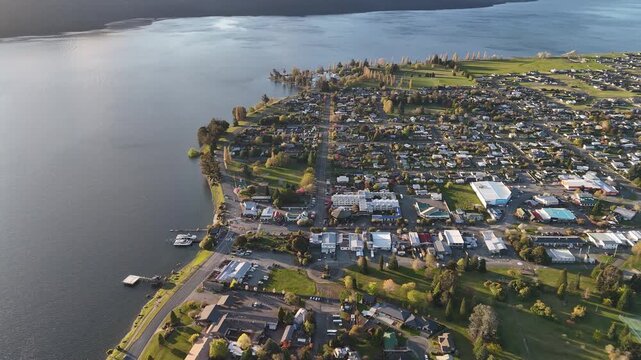 4K60 Drone View of Te Anau Town in New Zealand next to the River. Fiordland Region New Zealand