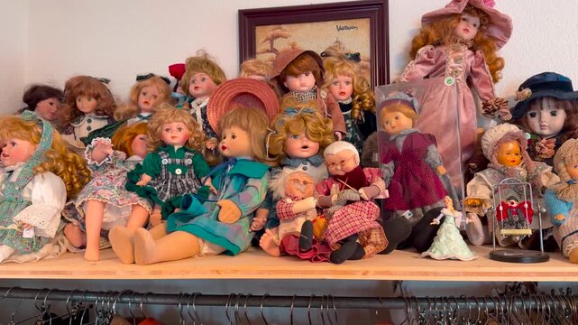 Vintage dolls and toys in a German thrift store, zoom in shot.