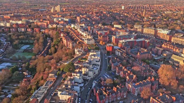 Drone glide over the historic Park Estate and the adjacent Nottingham Playhouse district in the city centre, red-brick villas , landmarks of Wellington Circus, including Albert Hall tower.