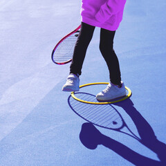 Faceless image of a girl playing during an after-school tennis activity